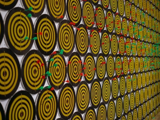 A wall of yellow and black circles on a wall.