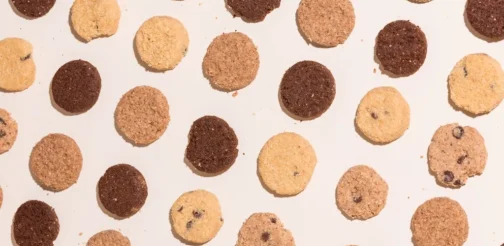 A group of cookies arranged in a circle on a white surface.