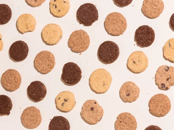 A group of cookies arranged in a circle on a white surface.